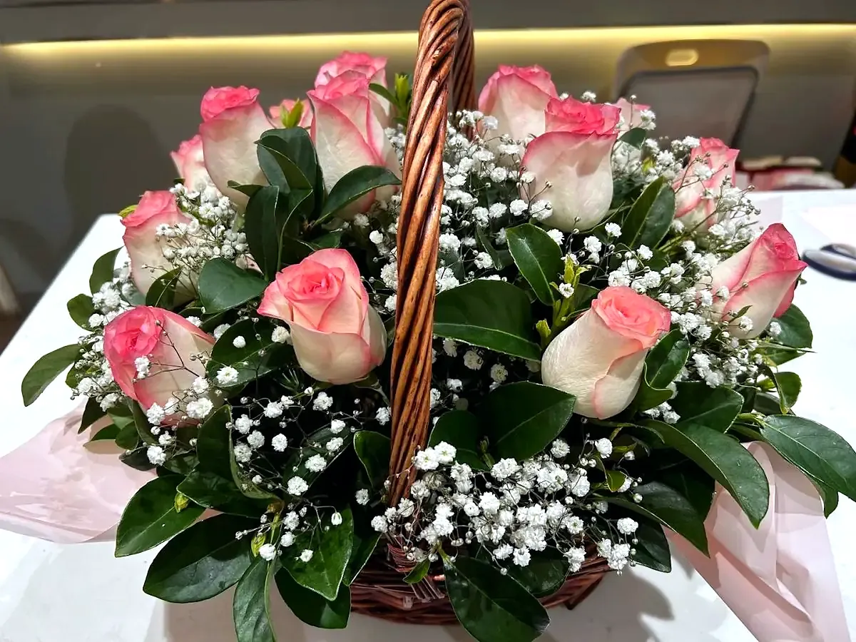 Basket of pink roses and baby's breath